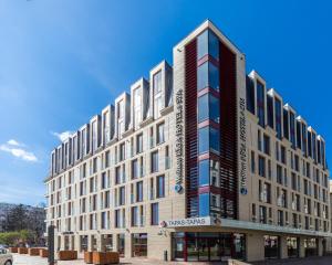 a large building on the corner of a street at Wellton Riga Hotel & SPA in Rīga