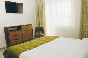 Ένα ή περισσότερα κρεβάτια σε δωμάτιο στο Ніка