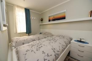 Postel nebo postele na pokoji v ubytování Appartementhaus "Pavillon" Appartement PAV02