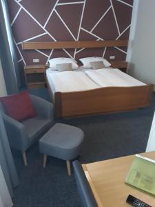 מיטה או מיטות בחדר ב-Wirtshaus Birkenhof