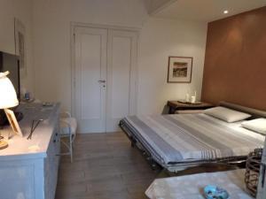 A bed or beds in a room at La Casetta - Near the sea & free parking