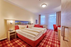 Postelja oz. postelje v sobi nastanitve Hotel Elbparadies