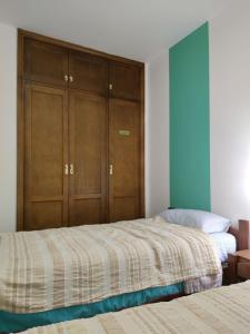 Łóżko lub łóżka w pokoju w obiekcie Apartamento Vista al Mar