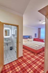 Postelja oz. postelje v sobi nastanitve Hotel Elbparadies