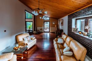 a living room with a couch and a table at Hotel Imperial Residence in Sandomierz
