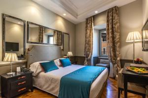 Postel nebo postele na pokoji v ubytování Hotel Lunetta