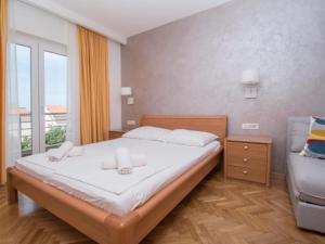 Postel nebo postele na pokoji v ubytování Apartments Antonio