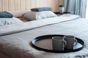 Sodybos kompleksas - ECO Resort Trakai tesisinde bir odada yatak veya yataklar