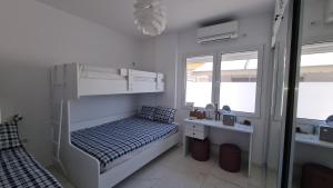 Postel nebo postele na pokoji v ubytování Rocknest Sea View Penthouse