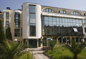 a large building with a lot of windows at Hotel Kerber in Podgorica