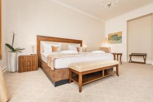 Postel nebo postele na pokoji v ubytování Hotel Le Premier