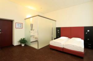 Ένα ή περισσότερα κρεβάτια σε δωμάτιο στο Hotel Rio Muralto