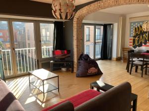 a living room with a couch and a table at James D in De Haan