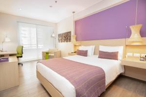Ένα ή περισσότερα κρεβάτια σε δωμάτιο στο Hotel Bari Bucaramanga