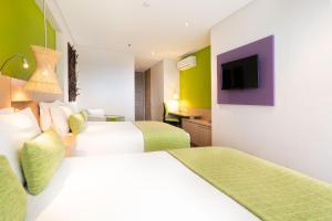 Ένα ή περισσότερα κρεβάτια σε δωμάτιο στο Hotel Bari Bucaramanga