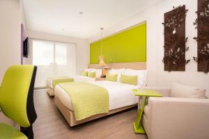 Ένα ή περισσότερα κρεβάτια σε δωμάτιο στο Hotel Bari Bucaramanga