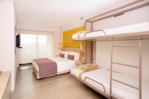Ένα ή περισσότερα κρεβάτια σε δωμάτιο στο Hotel Bari Bucaramanga