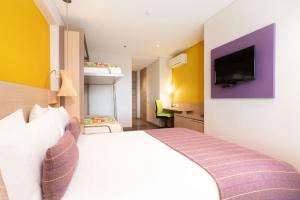 Ένα ή περισσότερα κρεβάτια σε δωμάτιο στο Hotel Bari Bucaramanga