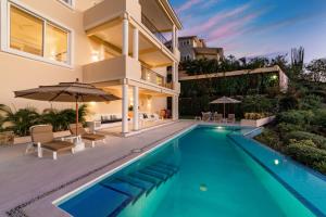 an image of a house with a swimming pool at 1031 - Villas Carey Condo in Santa Maria Huatulco