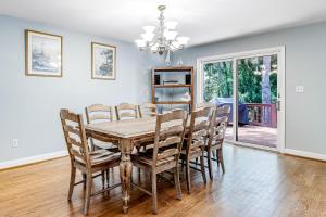 a dining room with a table and chairs at Baywood Luxury in Seabrook Island