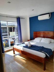 Llit o llits en una habitació de Park View Hotel & Restaurant