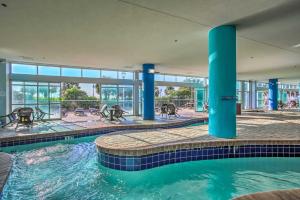 a swimming pool in the middle of a building at Beachfront Family Condo with View and Pool Access in Myrtle Beach