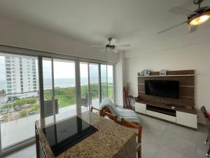 a living room with a view of the ocean at Departamento vista al mar 2D in Tonsupa