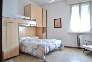 Postel nebo postele na pokoji v ubytování Lombardi Fleming + 11 fotografií