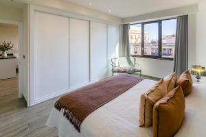 Postel nebo postele na pokoji v ubytování Apartamento Gran Capitán Uno