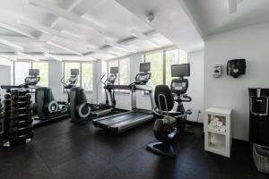 a gym with two treadmills and cardio machines at 2500 Penn, a Placemakr Experience in Washington