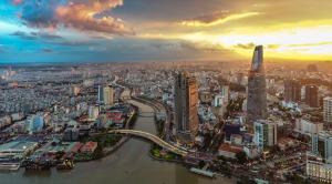 an aerial view of a city with a river and buildings at Little Brick Saigon Hotel in Ho Chi Minh City +26 photos