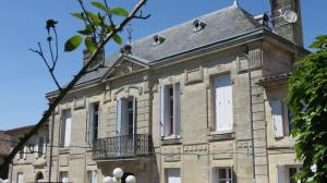 an old stone building with a roof at Château Bégot in Lansac