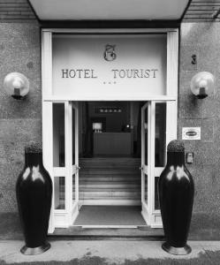 a black and white photo of a black and white building at Hotel Tourist in Turin