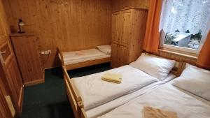 Postel nebo postele na pokoji v ubytování Penzion apartmány Aninka
