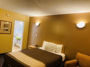 Postel nebo postele na pokoji v ubytování M Star Hotel Mansfield