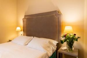 Postel nebo postele na pokoji v ubytování Hotel Viscardo