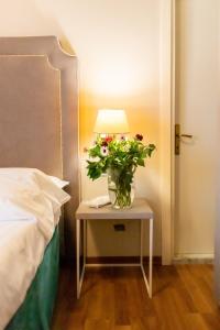 Postel nebo postele na pokoji v ubytování Hotel Viscardo