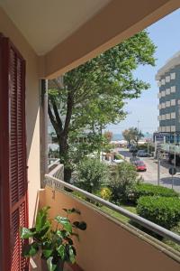a balcony with a view of a street at Aris Residence in Riccione