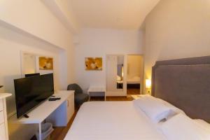 TV a/nebo společenská místnost v ubytování Hotel Viscardo