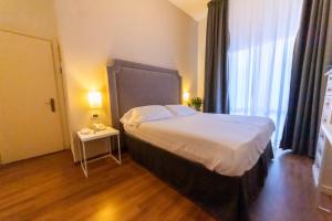 Postel nebo postele na pokoji v ubytování Hotel Viscardo