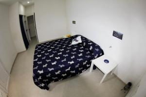 Łóżko lub łóżka w pokoju w obiekcie La Melagrana