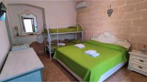 Postel nebo postele na pokoji v ubytování Masseria Prisuti