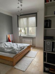 Posteľ alebo postele v izbe v ubytovaní Apartament Koszykowa 1