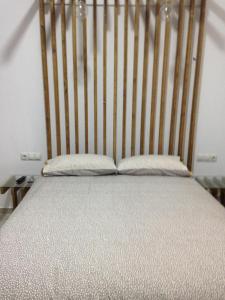 Łóżko lub łóżka w pokoju w obiekcie La casita de AO