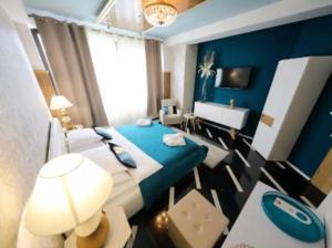 Postel nebo postele na pokoji v ubytování Residence Antiqua Rooms