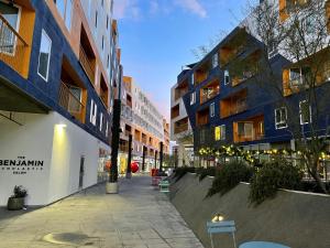 a street in a city with tall buildings at Perfect Apt w Parking Gym Pool WIFI in Arts District DTLA near Little Tokyo B4 in Los Angeles