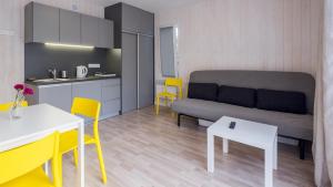 Kuchyň nebo kuchyňský kout v ubytování MEDUSA apartamenty i bungalowy