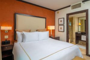 A bed or beds in a room at Luxury Balcony Suite - Across the Beach and Espanola Way