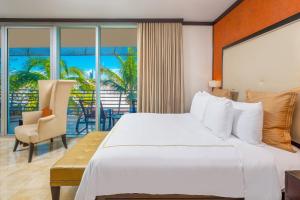 A bed or beds in a room at Luxury Balcony Suite - Across the Beach and Espanola Way