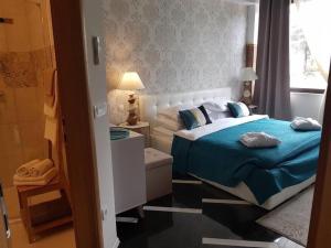 Postel nebo postele na pokoji v ubytování Residence Antiqua Rooms